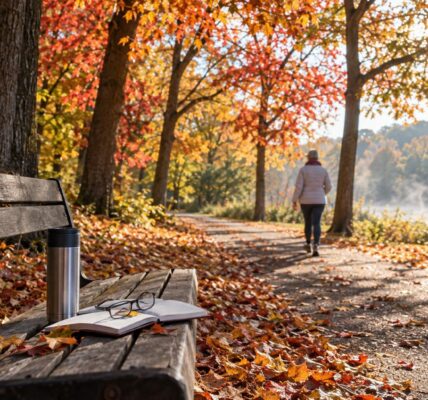 Morning walking trail lined with autumn trees and golden sunlight, a peaceful reminder of daylight and dementia risk research